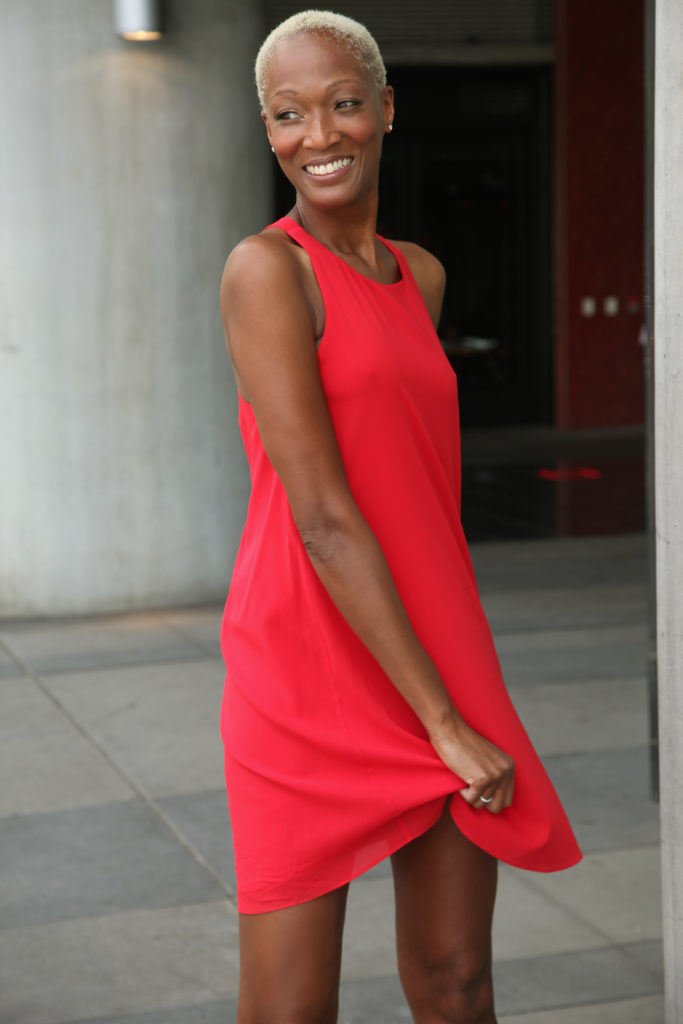 Picture of Stephanie in a red dress, smiling